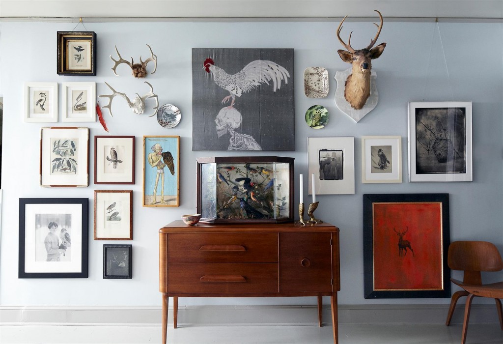 Audubon prints, an embroidery piece by Angelo Filomeno, and photographs by Abranowicz, Victor Schrager, Tom Baril, and George Tice, among others, line the walls of the gallery; the cabinet was found at auction. 