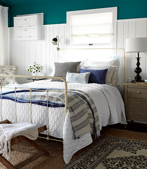 country bedroom with teal colored accents