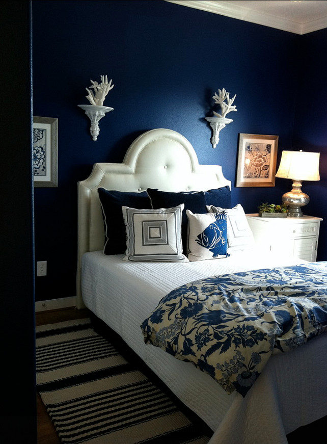 Benjamin Moore Admiral Blue painted walls in the bedroom for a moody, dreamy, beachy vibe.