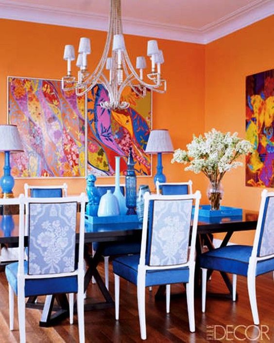 Blue and orange, tradition and tropics with walls painted in Benjamin Moore Calypso Orange