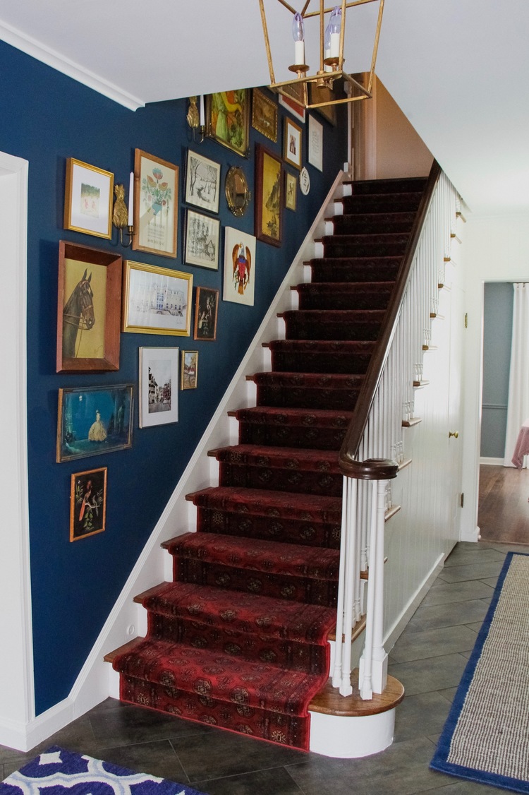 Benjamin Moore Washington Blue CW-630 painted stairwell with red carpet.