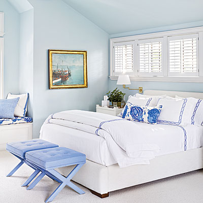 Soothing blue coastal styled bedroom with walls painted in Benjamin Moore's Sweet Bluette.