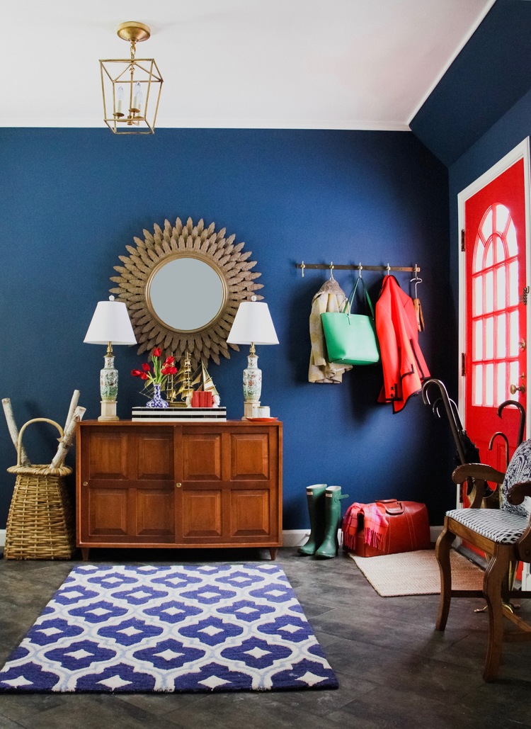 Blue and red entrance sunburst mirror. Walls painted in Benjamin Moore Washington Blue