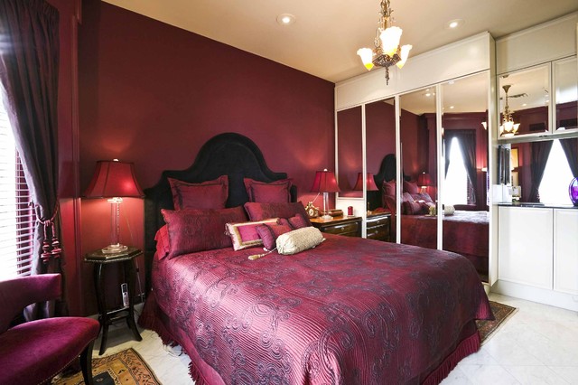 Traditional red master bedroom by Jerry Jacobs Design, Inc.