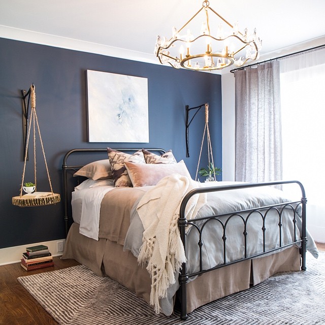 Accent navy blue wall in the bedroom painted in Benjamin Moore A Hale Navy HC-154
