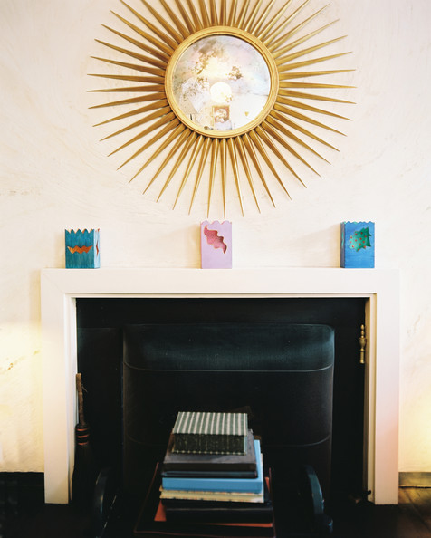 A gold starburst mirror above a fireplace Details: Beige-White Eclectic-Modern Living Room, Multicolored Eclectic-Modern Decor