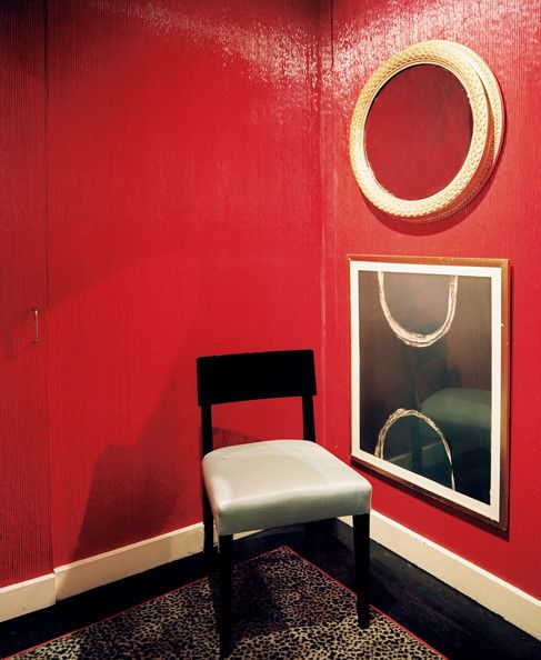 A leopard-print rug paired with glossy red walls Details: Black-Green Furniture, Red Eclectic-Modern Decor. Interior by Albert Hadley 