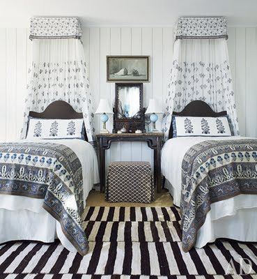 Amelia T. Handegan, a South Carolina interior decorator, used an eclectic assortment of Indian textiles and a graphic Persian kilim in this guest room at her bohemian bungalow in Folly Beach, near Charleston. (July 2011)