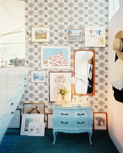 Wallpaper in an entryway mixed with art and a blue storage piece Details: Black-White Wall Treatment, White Modern Staircase, Black-Blue Eclectic Entry. Interior by Albert Hadley 