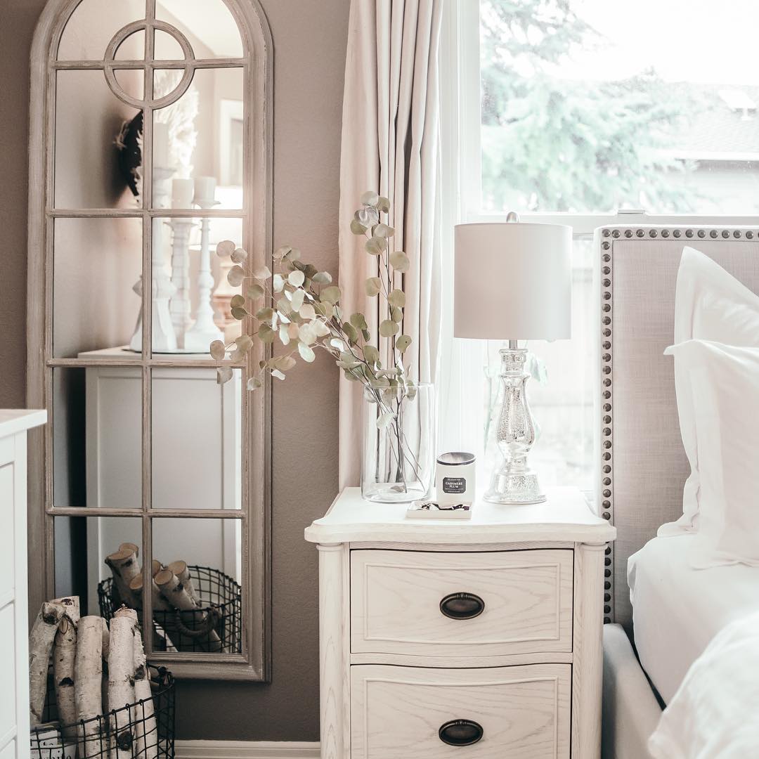 The mirror on the left of the bed is well placed and extends the idea of the window and light and space.