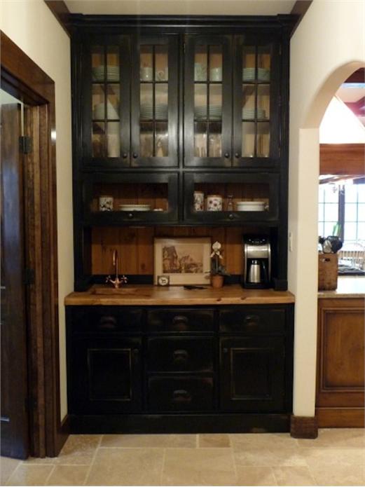 Farrow & Ball Pitch Black hutch with pine counter and tongue and groove back. Glass door hutch with a pair of lift-up chicken wire doors. Located in the garage entrance hallway.