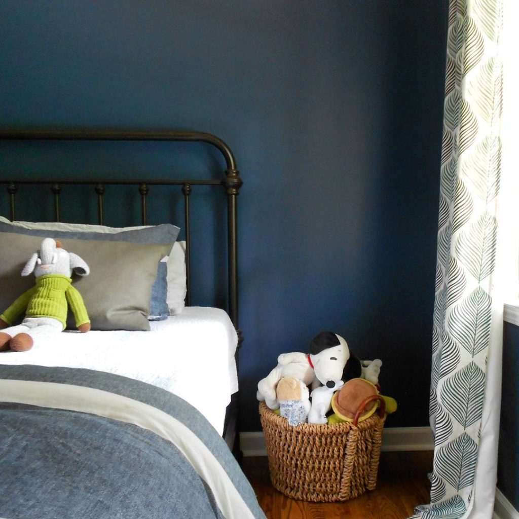 Navy blue bedroom color scheme with walls in Benjamin Moore's Van Deusen Blue