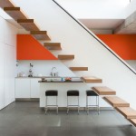 A Kitchen and a Sculptural Staircase