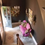 A Chocolate Brown Entryway with Pink Sofa