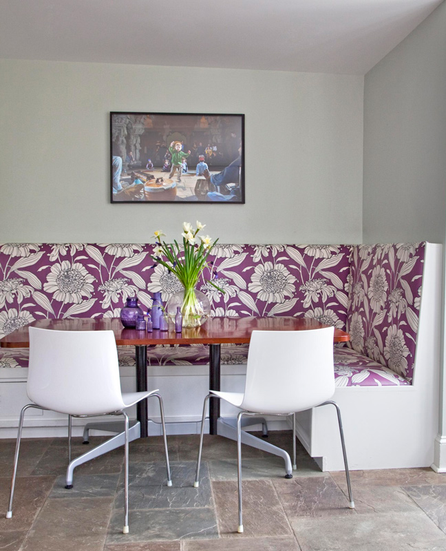Purple floral: A lively laminated fabric from Duralee covers the banquette.