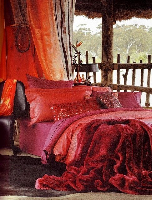 Rich shades of red and orange in this Bohemian style room