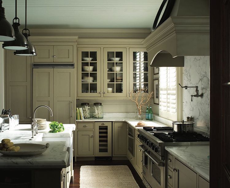 Kitchen cabinets are painted in Grasshopper AF-415 and ceiling in Iced Green 