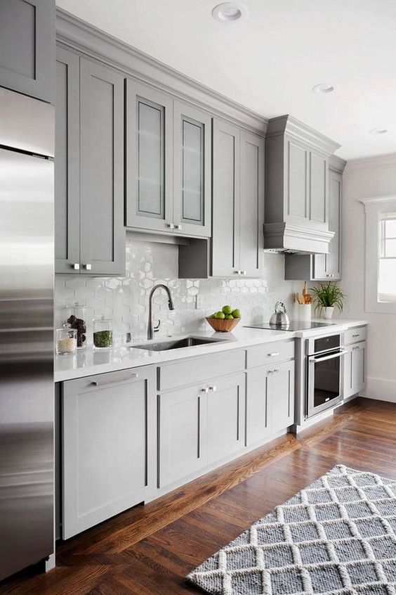 Shaker style kitchen cabinet painted in Benjamin Moore 1475 Graystone. The walls are Benjamin Moore Dove Wing.