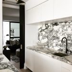 Black and White Marble Kitchen Color Scheme. Timber herringbone flooring kitchen, black taps and hardware.