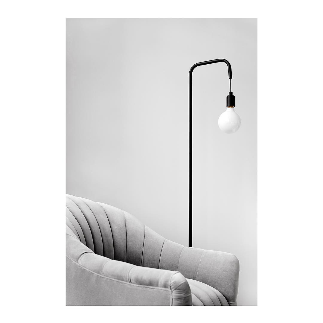 Light gray velvet armchair and walls