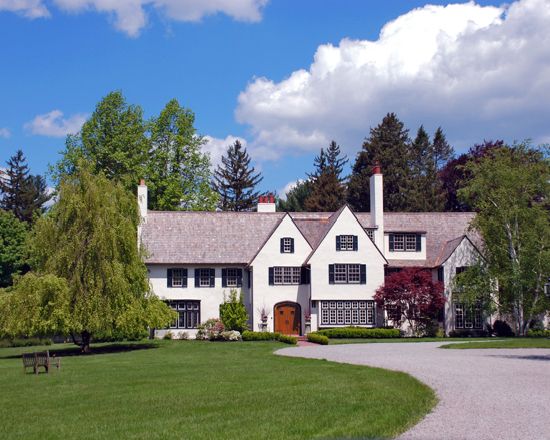 Tudor Home Exterior Painted in Benjamin Moore Simply White