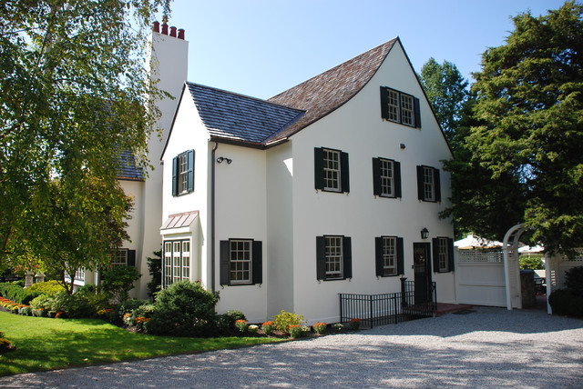 Tudor Home Exterior Painted in Benjamin Moore Simply White