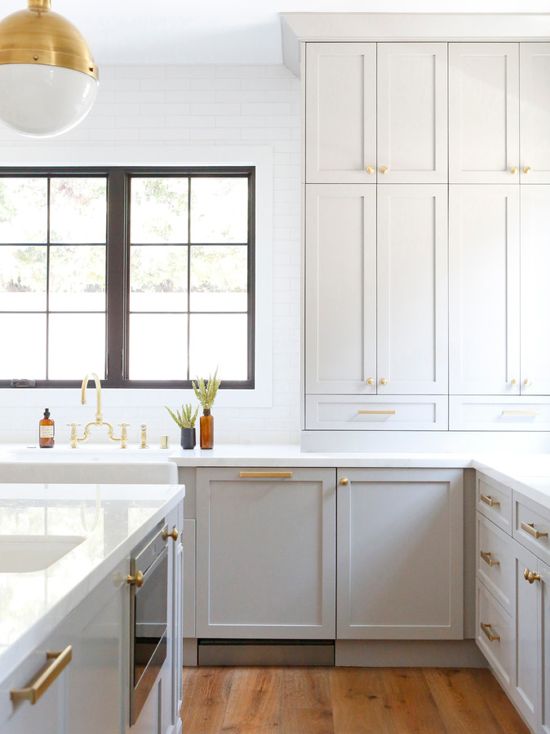 Benjamin Moore Gray Huskie Kitchen Cabinets and Brass Fixtures. Light gray and brass paint color scheme kitchen