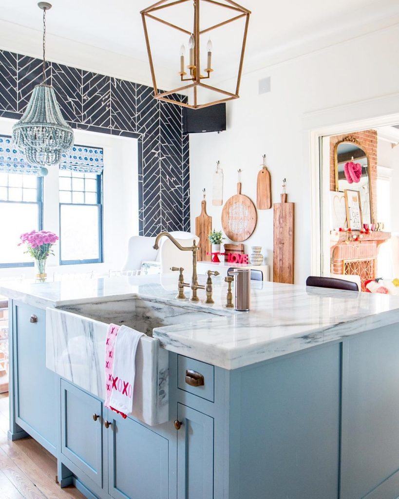 modern vintage kitchen in powder blue, white and black with pink accents