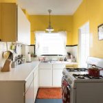 Modest kitchen with yellow painted walls