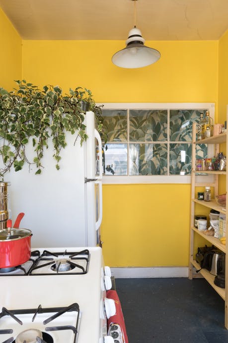 Modest kitchen with yellow painted walls