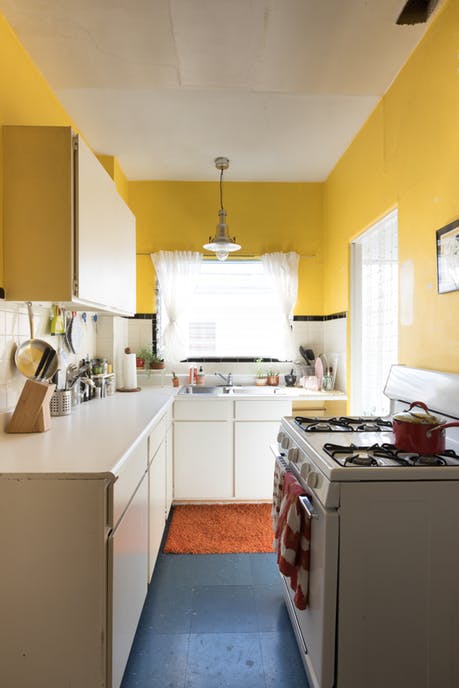 Modest kitchen with yellow painted walls