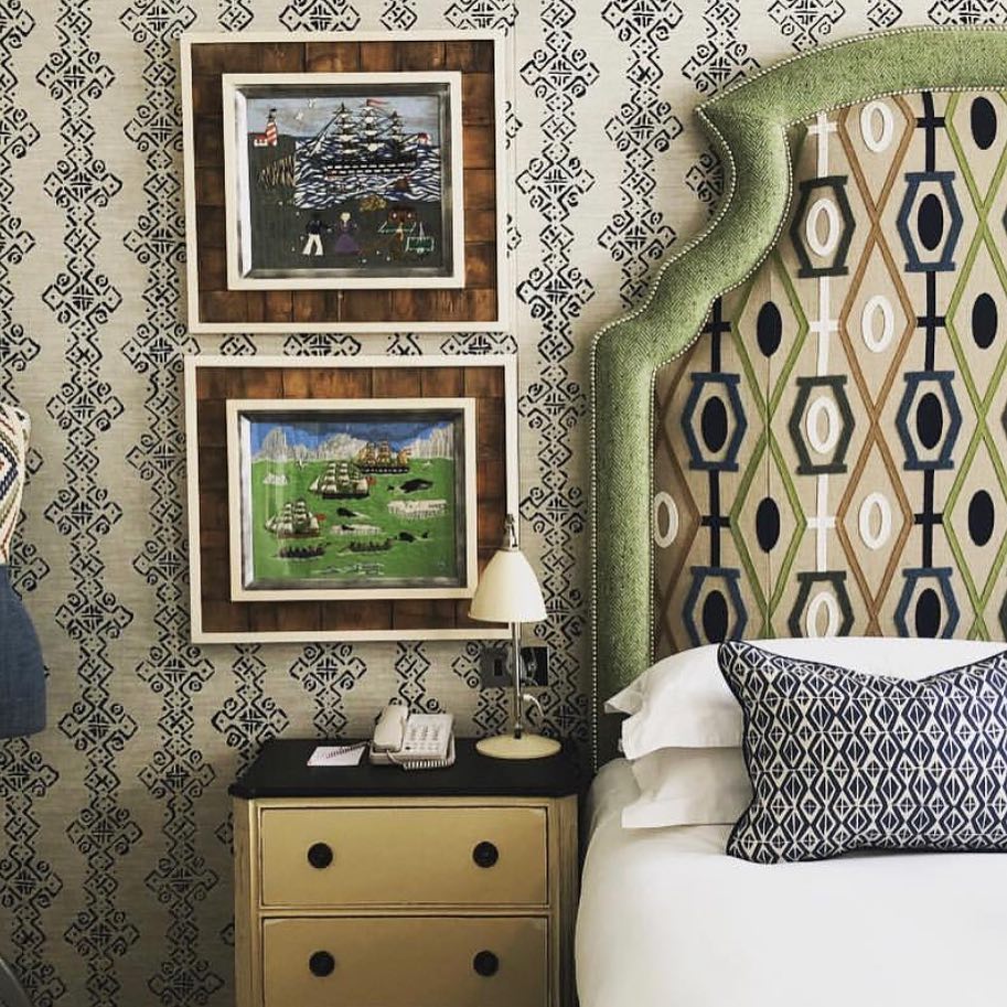 Blue and green bedroom with upholstered walls.