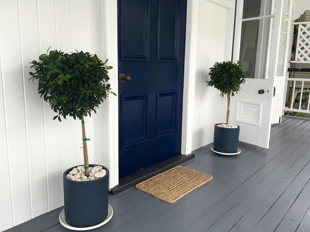 Grey paint color for the deck Dulux Guild Grey, Navy blue painted front door. Navy, gray and white exterior paint color scheme.