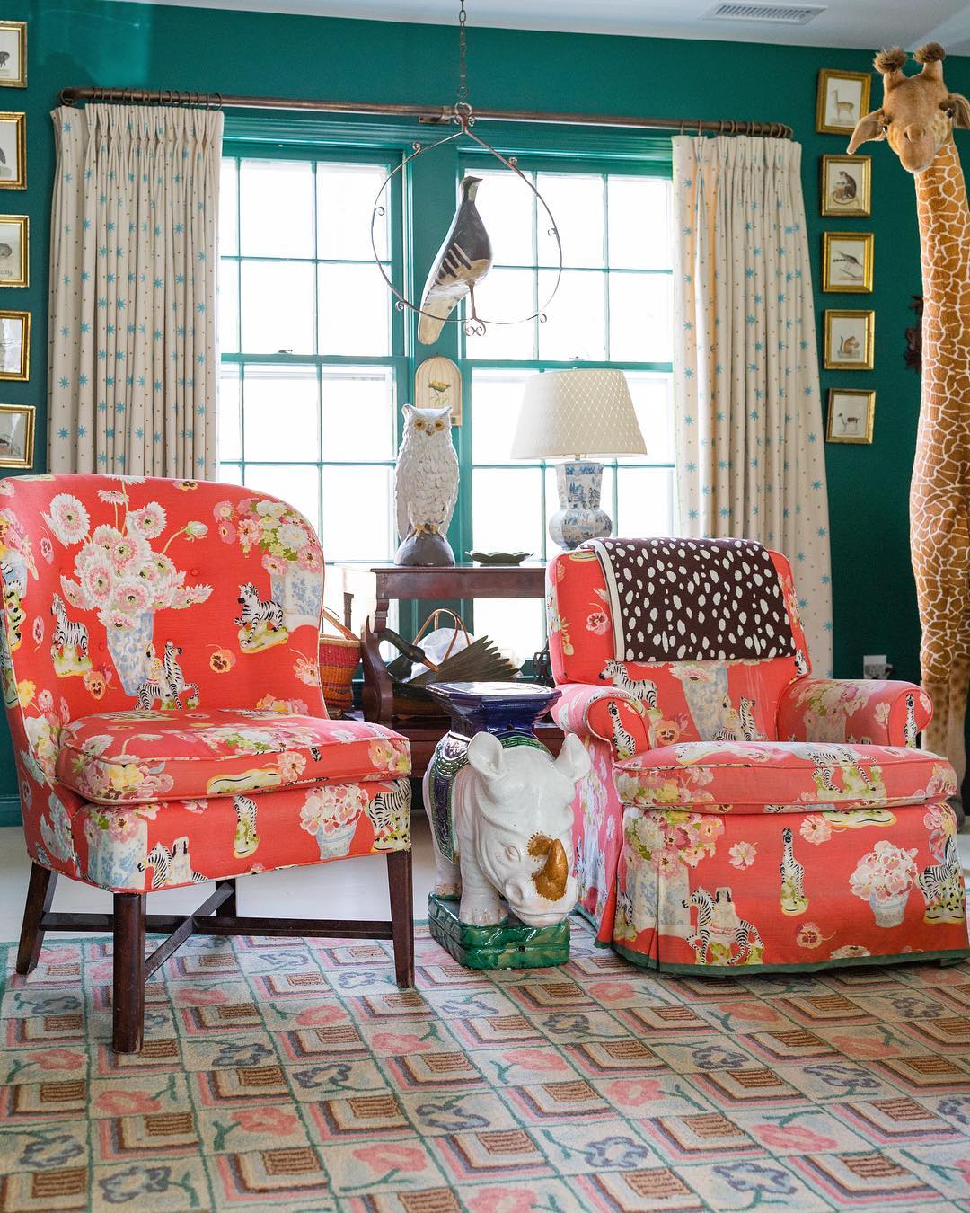 Living room in a green and coral color scheme with an animal motif interior design.