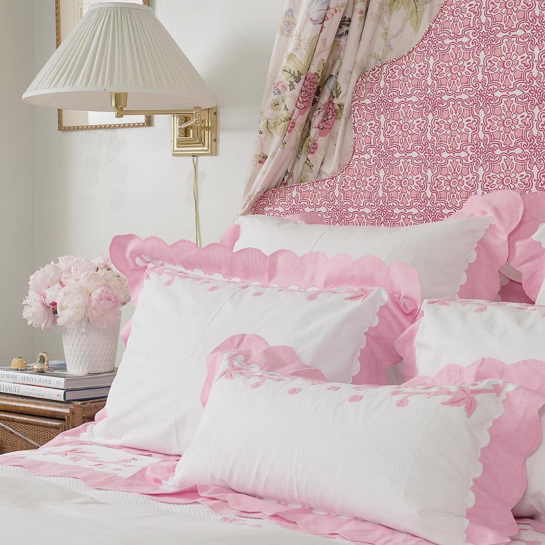 Pink canopy bed with florals by Blithfield Fabrics.