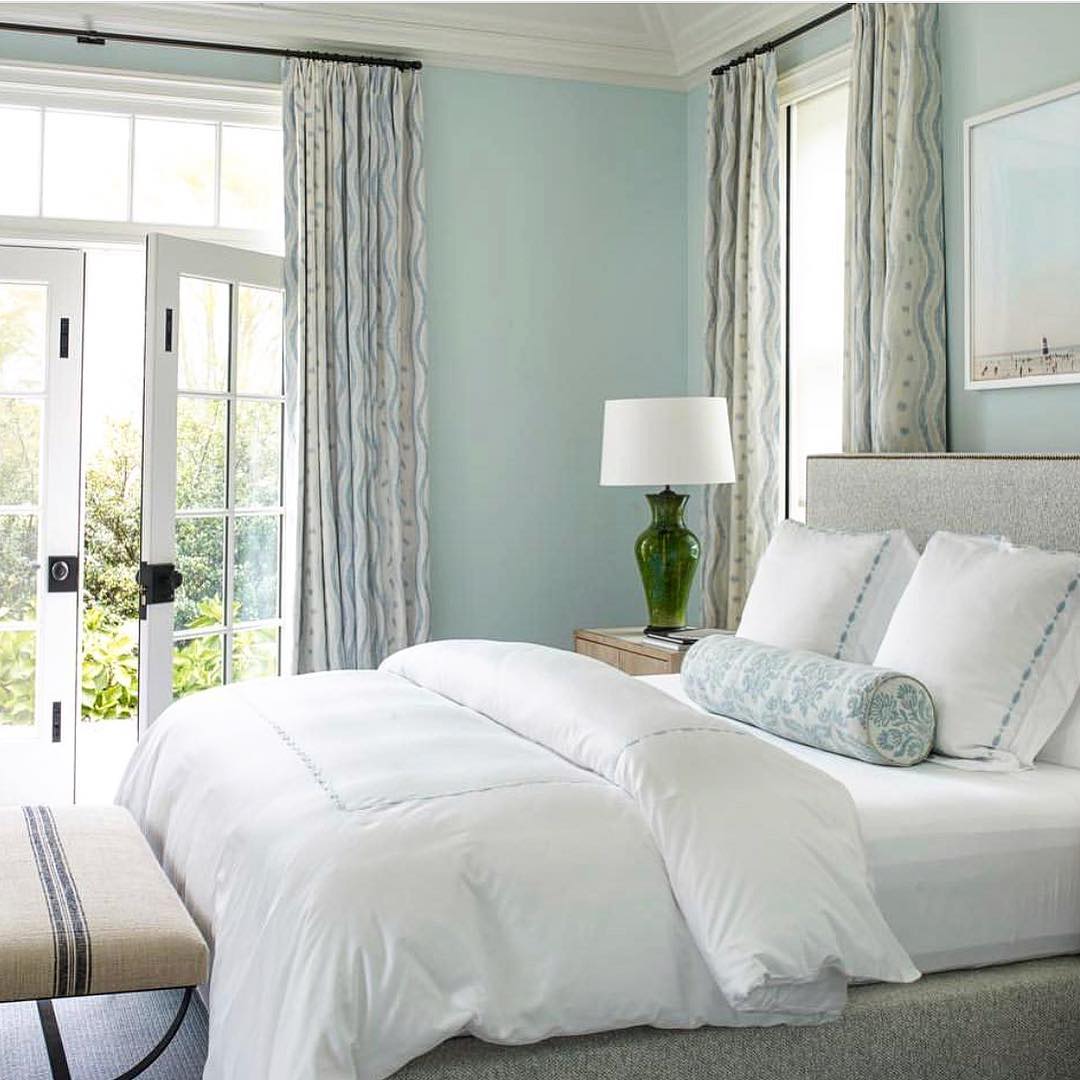 Traditional bedroom with a light blue color scheme and Ikat Stripe curtains by Blithfield.