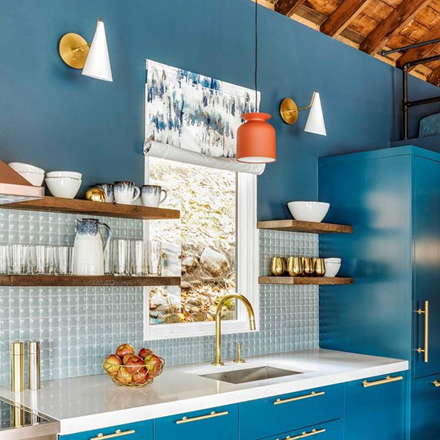 Blue kitchen with brass hardware