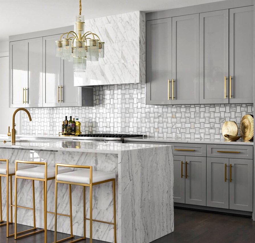 Callacatta gold marble waterfall kitchen counter and gray painted kitchen cabinets