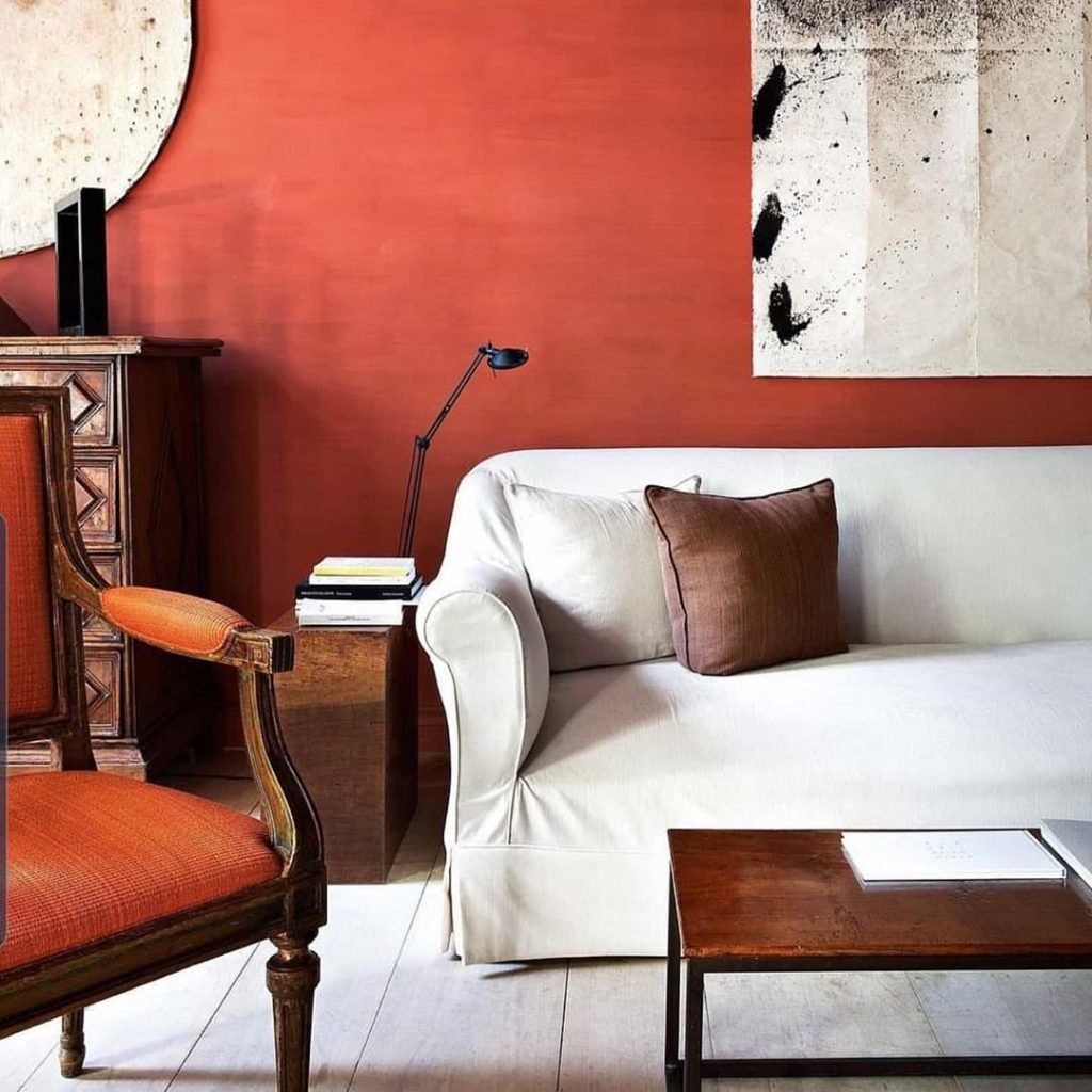 Living room with terracotta red walls