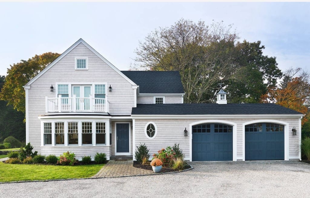 House exterior garage doors and front door painted in Newburyport Blue