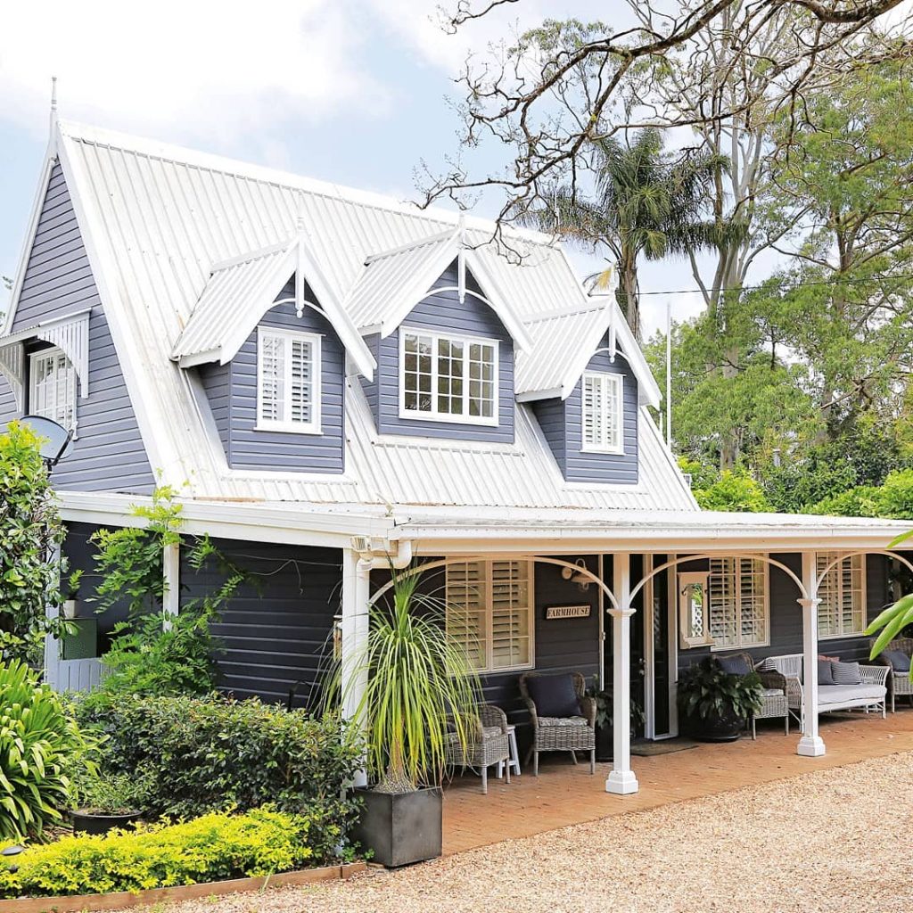 Country home exterior painted in gray and white