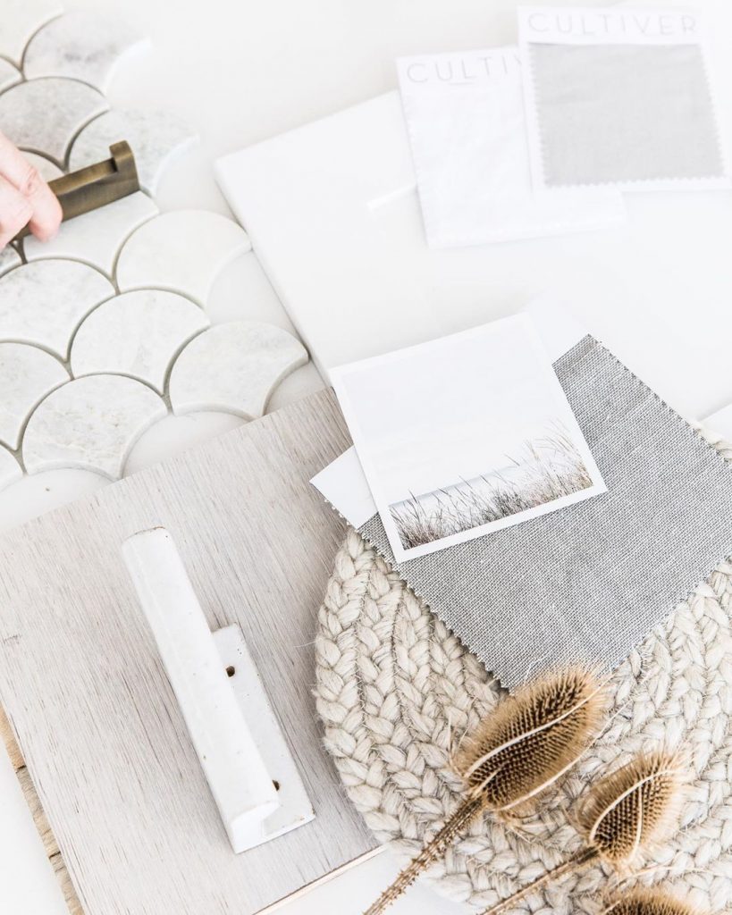 Flat lay in white and neutrals fishscale tiles