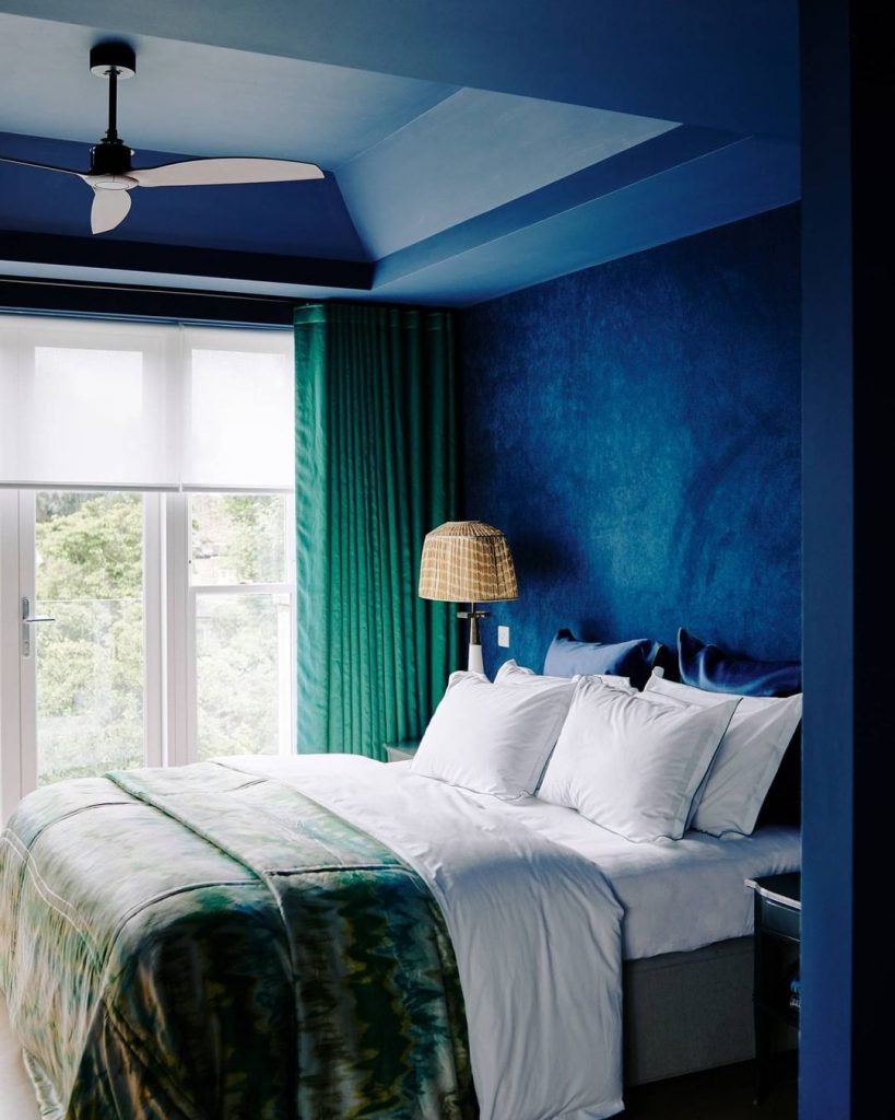 Luxurious blue and green master bedroom interior 2020