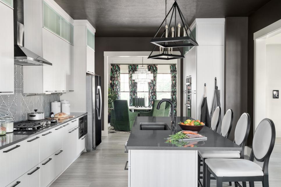 A large island covered in a charcoal-hued quartz countertop is the central hub of the kitchen. It provides plenty of prep space, dining for four and it’s also a nice spot to visit with the cook while they’re preparing a meal.