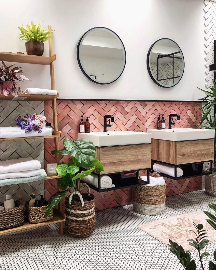 Pink herringbone tiles bathroom walls