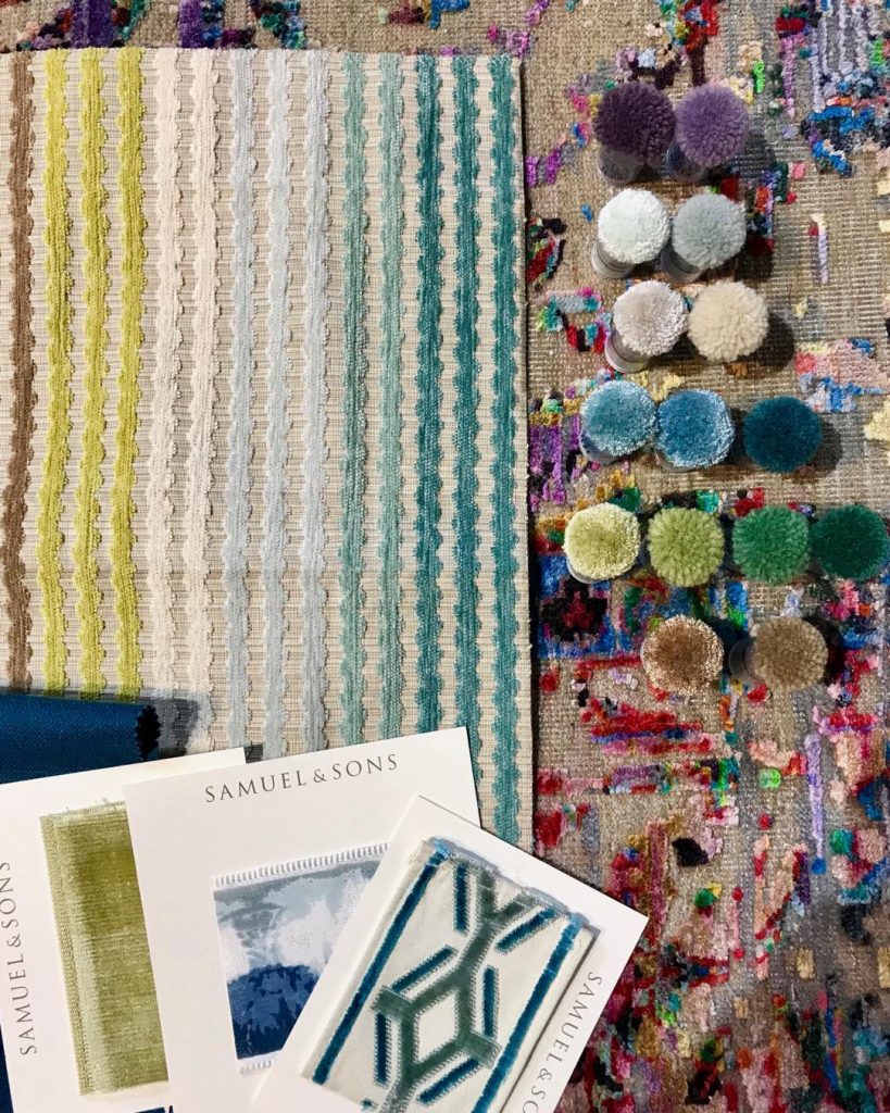 Custom rugs are really not that scary. And sometimes they’re the perfect fit! Our client has a penchant for color, so we picked the pattern and the appropriate size, then selected poms to match our fabrics.