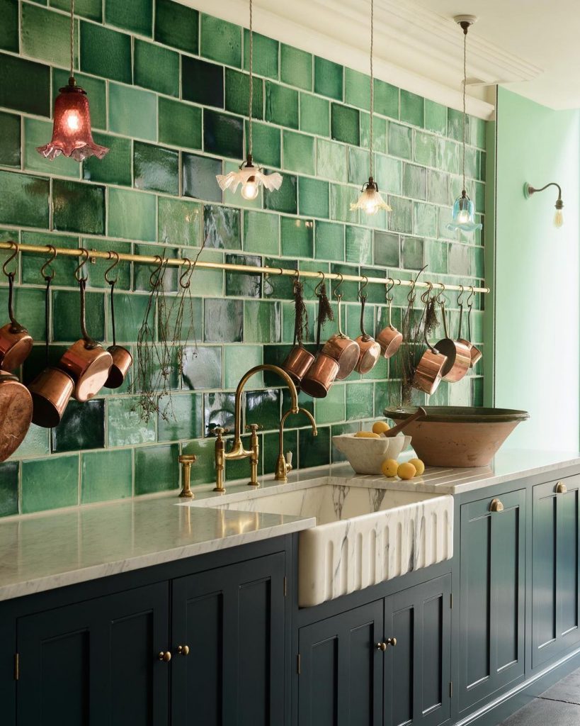 Green kitchen with a marble sink