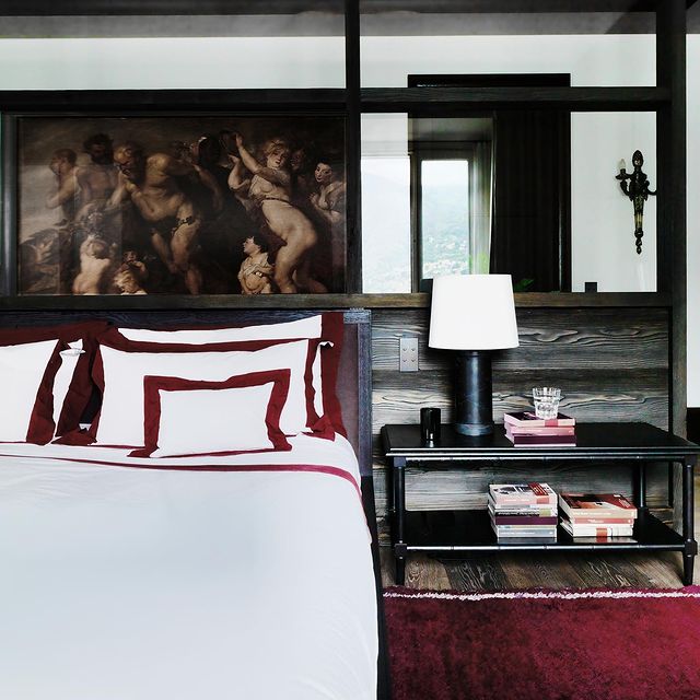 Traditional bedroom design red and dark wood