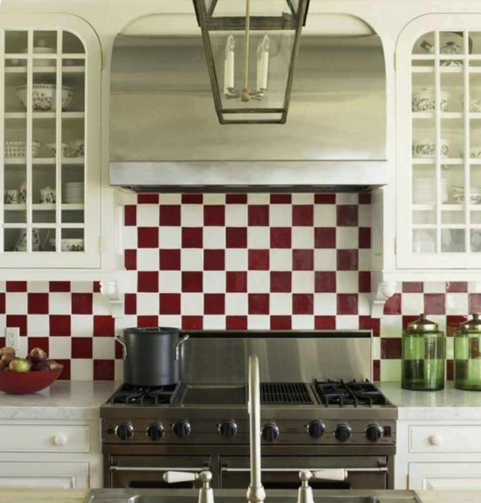 White kitchen red and white tiles splashback