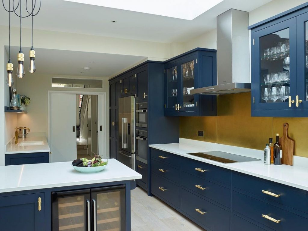 Little Greene Paint Basalt navy painted kitchen cabinets and brass hardware